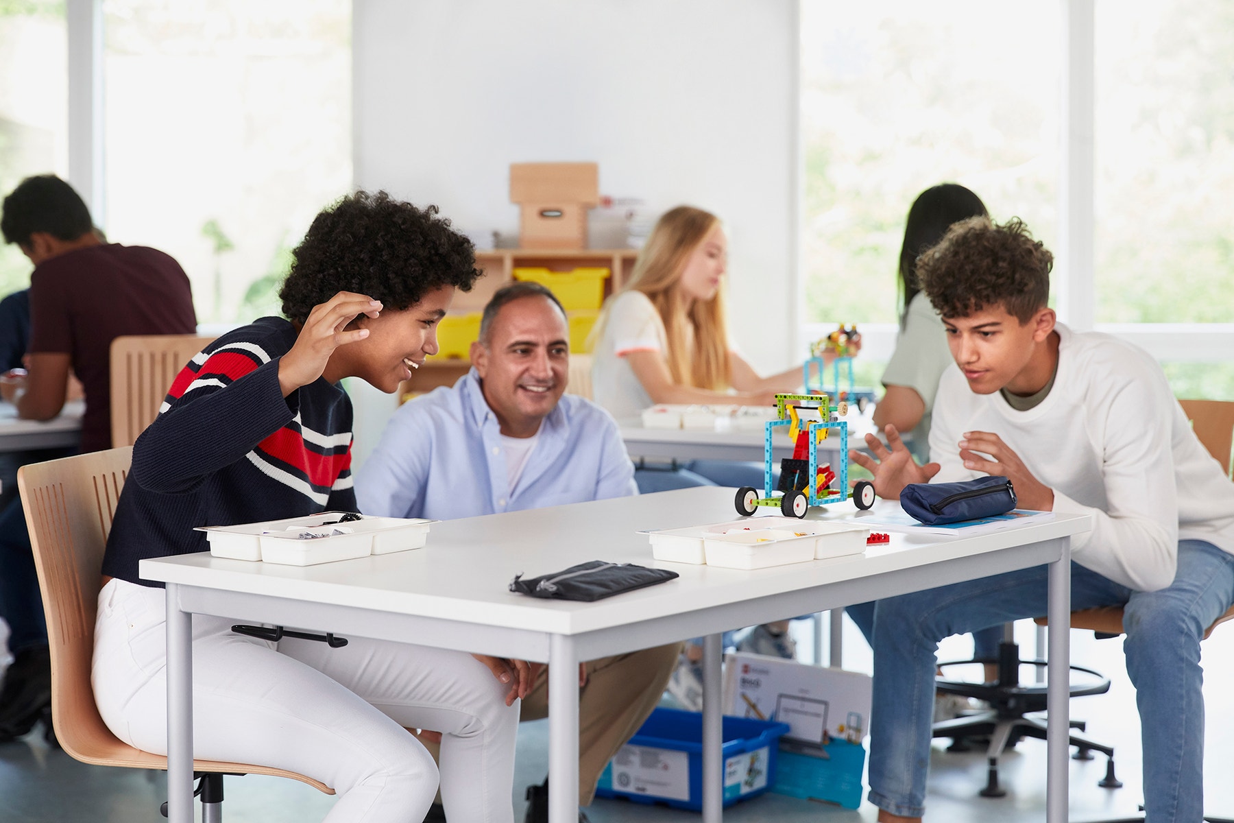 Students building a force kit