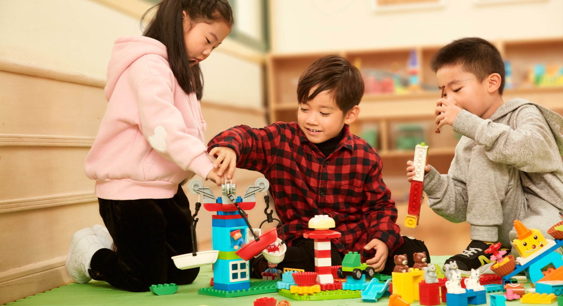 Students building rides for a kindergarten STEAM project