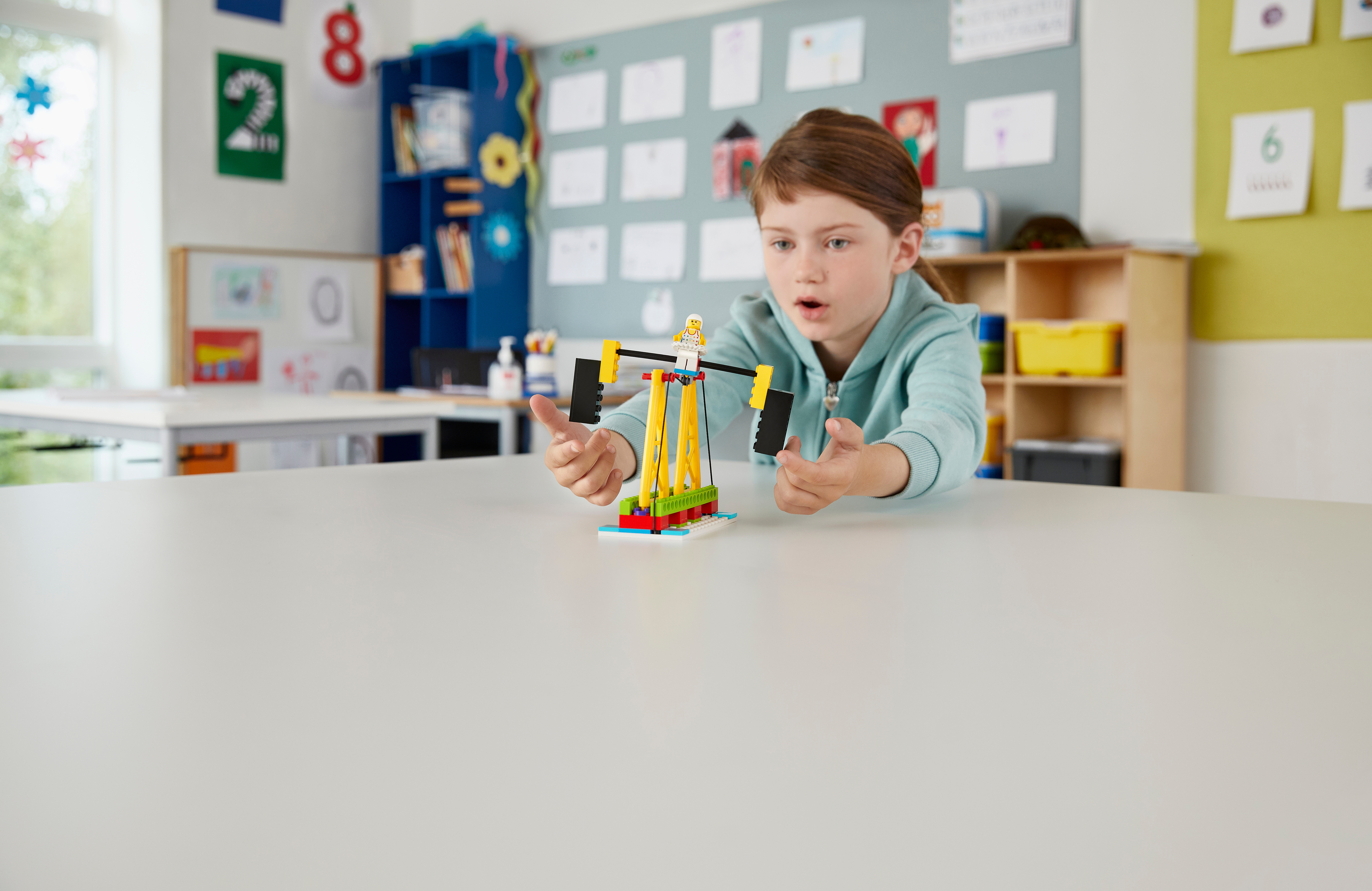 Student building a tightrope walker set