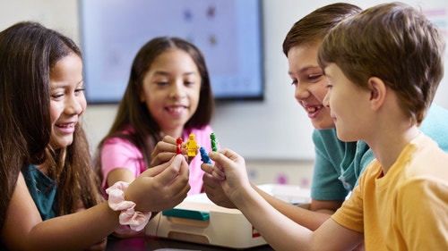 Students participating in a science lesson with LEGO Education Science.