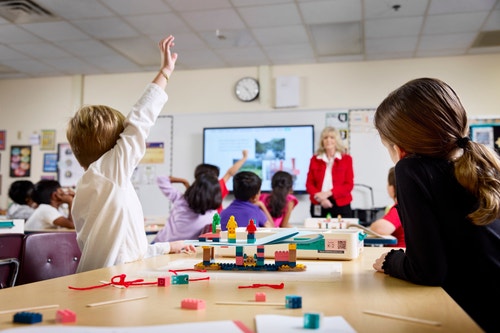 Students and teacher doing a LEGO Education Science lesson.