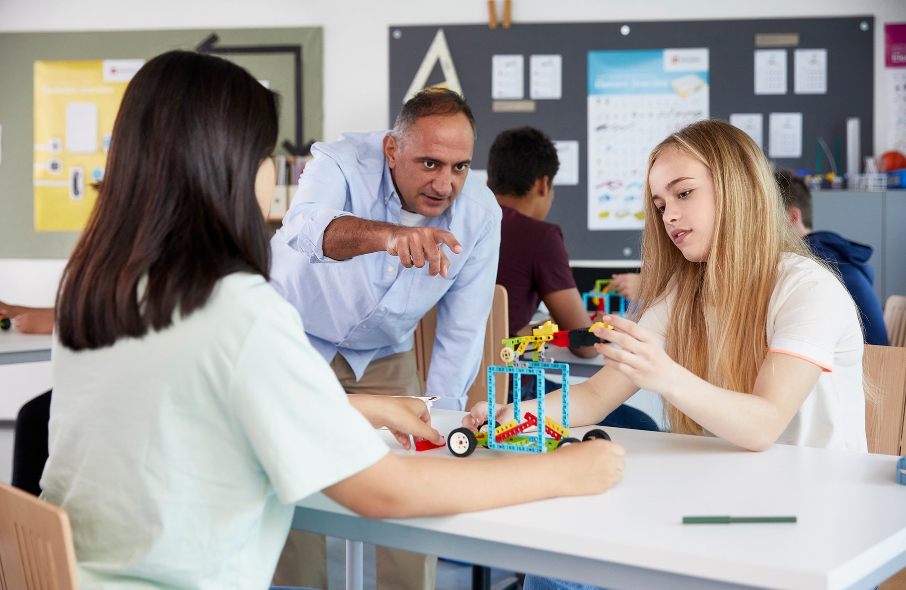 Students working on a science motion set